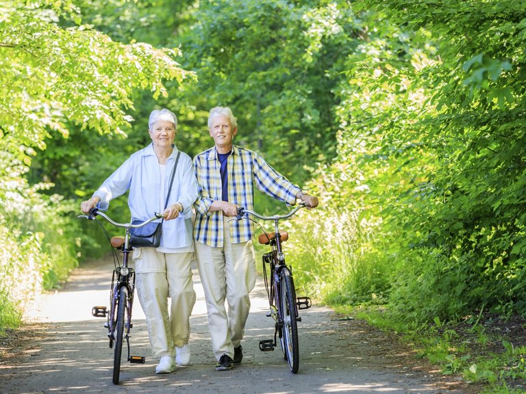 Elderly couple with their bicycles